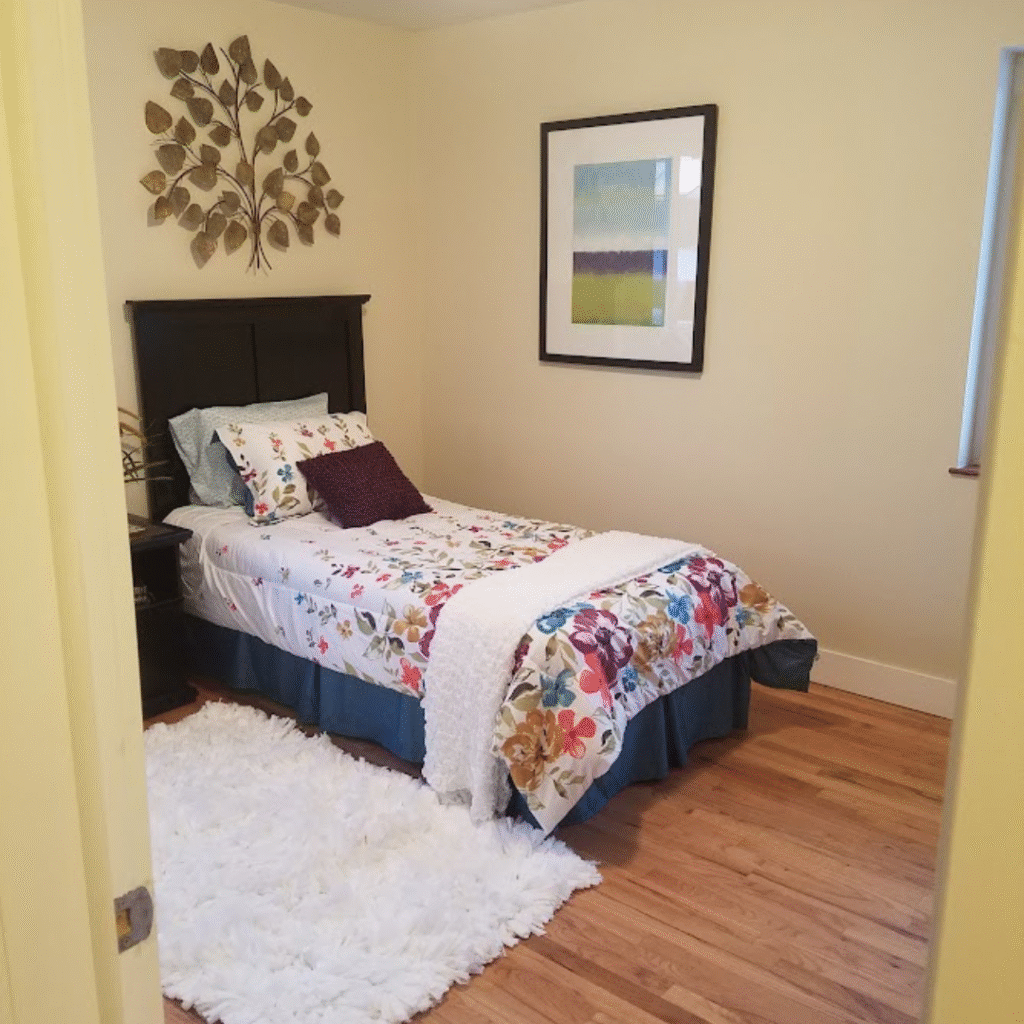 Guest bedroom renovation with fresh paint and new flooring in Denver