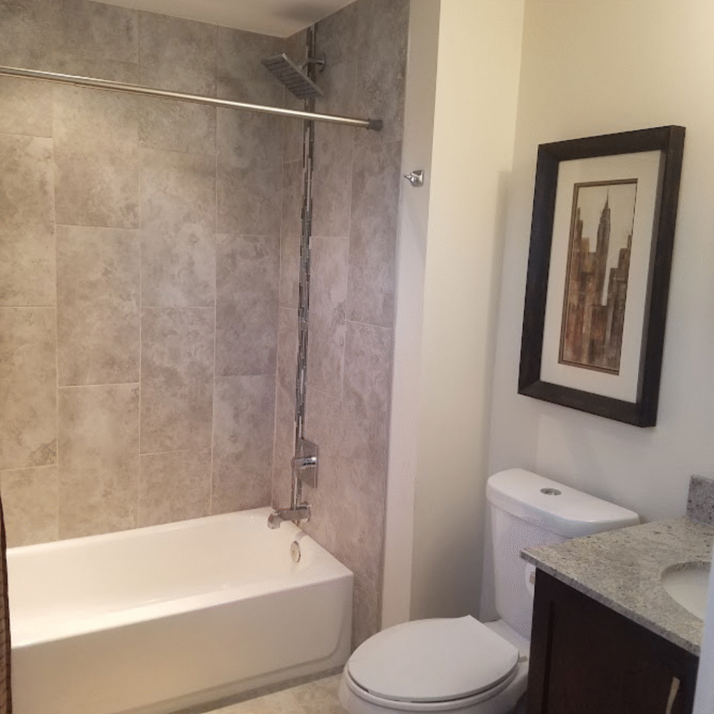 Bathroom renovation with new bathtub and wall tiles in Lakewood